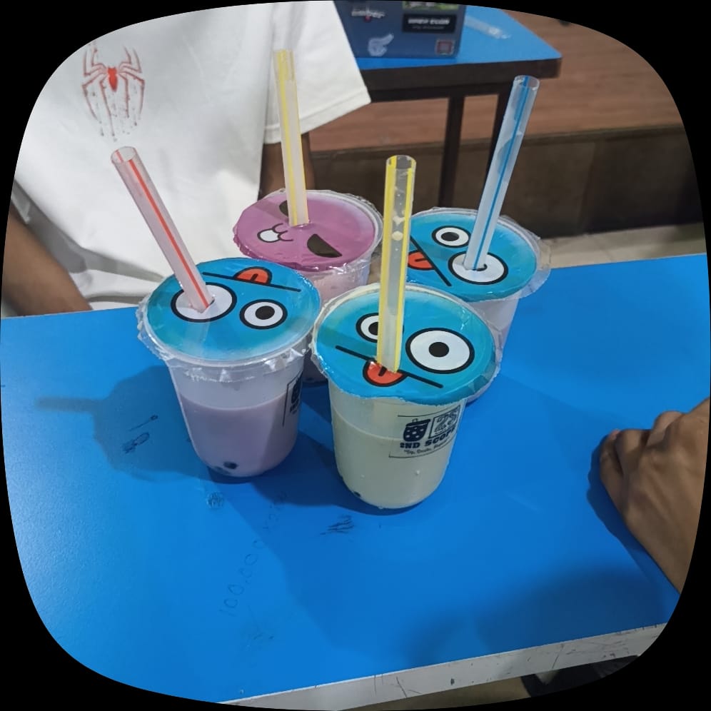 First boba glass on a wooden shelf